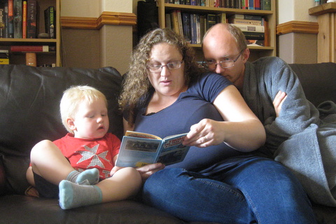 Daniel, Becky and David enjoying a 'Thomas the Tank Engine' book