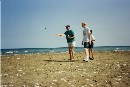 Playing boule with stones on the beach in June