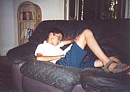 Tim relaxing on a sofa