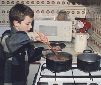Tim cooking in our kitchen
